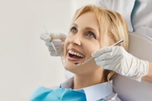 Happy patient woman individual examination in dental clinic for oral health treatment, dentist exam, teeth, gum care, doctor visit, whitening, client satisfied with stomatology modern clinic service