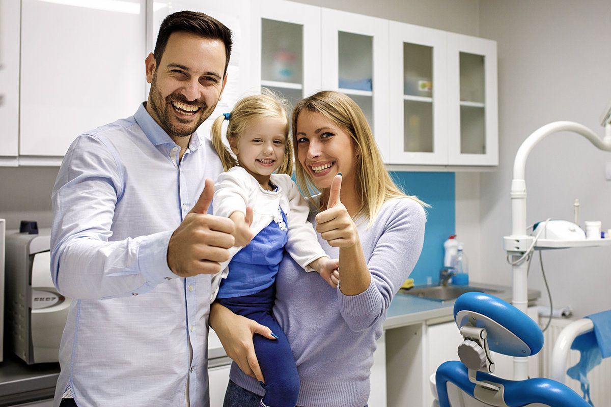 Happy family at a dental office