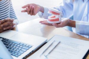 Dental consultation with model teeth