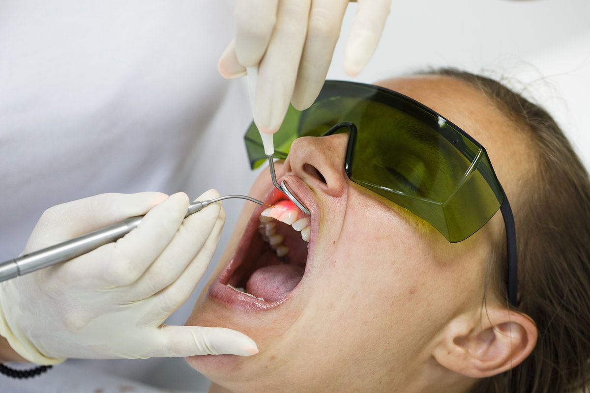Dental procedure with patient wearing goggles